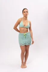 Minifalda tejida a crochet color celeste agua, con cintura con cordón ajustable color verde lima.