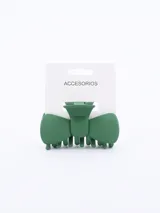 Pinza para el pelo color verde oscuro con forma de moño.