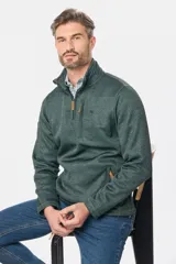 Buzo de felpa con interior de polar, diseño de medio cierre frontal, cuello alto y bolsillos laterales y en el pecho con cierres.