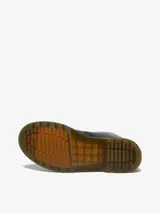 Botas de caña media Dr. Martens modelo 1460, color negro, con cierre de cordones de 8 ojales, costuras amarillas distintivas en la suela y lengüeta trasera con logo.