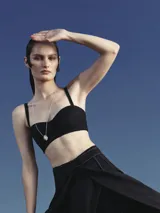 Mini top corset negro de breteles finos no regulables.