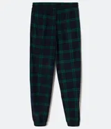 Pantalón de pijama de franela con estampa cuadrillé en tonos azul y verde. Tiene puños elásticos en los tobillos y cordón ajustable en la cintura.