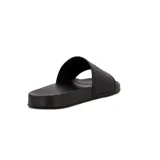 Chanclas negras de goma con tira ancha y logo de Diadora en relieve.