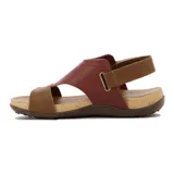 Sandalia casual de mujer con dos tiras y pulsera al tobillo con cierre ajustable. Presenta capellada de cuero negro, plantilla acolchada y suela tipo corcho con base marrón antideslizante.