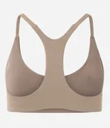 Top deportivo de microfibra color verde militar, con escote redondo, copas incorporadas y espalda nadadora. Marca Get Over.