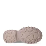 Championes blancos con plataforma alta y suela con diseño irregular.