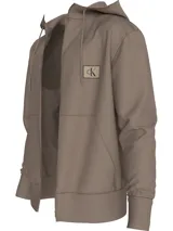 Buzo con capucha color marrón claro, con cierre frontal, bolsillos laterales y puños y dobladillo acanalados. Presenta un parche con el logo de Calvin Klein en el pecho.