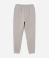 Pantalón jogger deportivo de hombre en color azul, con cintura elástica ajustable con cordón, bolsillos laterales con cierre de cremallera y bajo ajustado con puño elastizado.