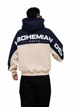 Hoodie oversize color azul marino y beige, con capucha, mangas largas y el texto "BOHEMIAN DEPTS" estampado en la espalda y mangas.