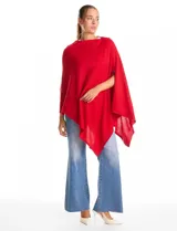 Poncho tejido de la marca Do Everything In Love, con diseño asimétrico y caída fluida.