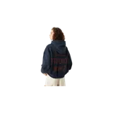 Hoodie oversize de color azul marino, con capucha, bolsillo frontal tipo canguro y pequeño estampado gráfico de la marca en el pecho.