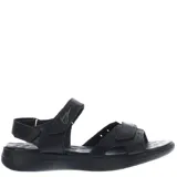 Sandalias de cuero color marrón con ajuste de velcro en el empeine y el talón. Presentan una suela de goma ergonómica en tono gris y logo de la marca grabado en la tira superior.