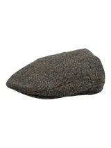 Boina de lana Harris Tweed con patrón de cuadros en tonos marrón y gris, forro interior y diseño clásico.