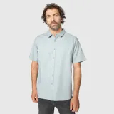 Camisa de manga corta con cuello clásico y cierre frontal de botones, confeccionada en una mezcla de lino.