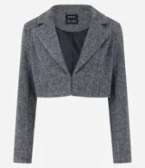 Blazer cropped de polivelour con textura espinha de pez, cuello con solapa y manga larga.
