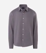 Camisa masculina Marfinno de corte slim en tono azul acero, confeccionada con cuello inglés, manga larga con puños abotonados y cierre frontal con botones. Incorpora tecnología Easy Care Performance para mayor elasticidad y facilidad de planchado.