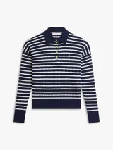 Sweater de punto trenzado Tommy Hilfiger a rayas horizontales azules y blancas, de corte amplio con hombros caídos, cuello tipo polo con solapa y botones dorados, y detalles en punto canalé en cuello, puños y bajo.