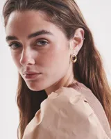 Aros tipo caravanas de alpaca con pernos y cierres mariposa de plata 925.