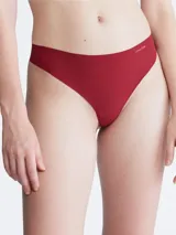 Colaless rojo de microfibra suave con bordes cortados a láser y logo de Calvin Klein estampado en la cadera.