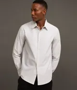 Camisa de vestir masculina de manga larga, confeccionada en tricolina con un sutil estampado de cuadros grid. Presenta cuello clásico, abotonadura frontal y puños con botones.