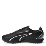 Championes de fútbol 5 Puma modelo Vitoria TT, color negro con detalles en blanco. Presentan un diseño deportivo con cierre de cordones, suela de goma resistente para un agarre óptimo y confección en materiales sintéticos de alta calidad.