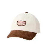 Gorra de visera curva confeccionada en pana, con cuerpo en color beige y visera en color marrón. Presenta un parche frontal con el logo de la marca en tonos rosados y marrones.