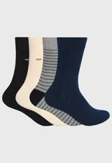 Pack de cuatro pares de medias de caña media marca Arrow, con diseños variados que incluyen colores lisos, rayas horizontales y detalles de puntos, con logo bordado.