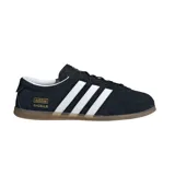Championes Adidas modelo Gazelle Lo Pro, color negro con las icónicas tres tiras laterales en blanco. Presenta un diseño de perfil bajo con capellada de gamuza, interior en contraste blanco y suela de goma color caramelo. Incluye el logo de la marca y el nombre del modelo en dorado en el lateral.