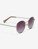 Gafas de sol unisex con montura plateada redonda y lentes degradadas de color uva.