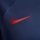 Camiseta de fútbol Nike del Paris Saint-Germain, modelo local temporada 2023/24. Diseño en color azul marino con una franja vertical roja y blanca descentrada hacia la izquierda, patrocinador principal en el pecho y logo de la marca en rojo.