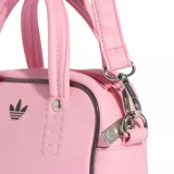 Bolso de mano Adidas modelo Adicolor XS, color rosado, con diseño compacto y estructura rígida. Presenta el logo del trébol de la marca en el frente, doble asa superior y correa ajustable y extraíble para llevar al hombro o cruzado.