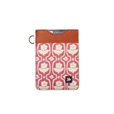 Billetera tarjetero vertical de tela estampada con diseño floral en tonos rosa y blanco, con borde superior de cuero marrón y detalle de logo de la marca en la parte inferior.