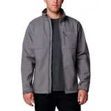 Campera softshell Columbia modelo Ascender, de color gris oscuro en la parte superior y gris claro en la inferior. Cuenta con cuello alto, cierre frontal completo, bolsillos laterales y en el pecho con cierre, y logo de la marca bordado.