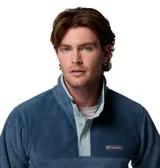 Buzo polar de la marca Columbia, modelo Steens Mountain, confeccionado en tejido fleece suave. Presenta cuello alto con cierre de botones a presión, mangas largas y un diseño de calce cómodo ideal para actividades al aire libre.