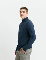 Cardigan de algodón con cuello alto y cierre frontal completo. Presenta mangas largas tipo ranglan y bolsillos laterales de ribete.