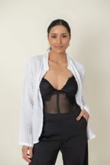 Body negro de tul elastizado con encaje en el busto y breteles finos regulables.