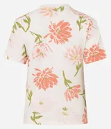 Blusa de corte slim confeccionada en algodón, con cuello redondo y mangas cortas. Presenta un estampado floral en tonos rosados y verdes sobre una base de color crema.