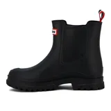 Bota de lluvia corta color beige, con suela track dentada y tirador trasero con detalle de cinta tricolor. Presenta un parche decorativo con la inscripción 'IRAIN' en el lateral.