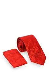 Corbata verde oscuro con estampado floral y pañuelo de bolsillo a juego.