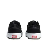 Championes de skate Vans modelo Era Wafflecup, color negro con suela blanca. Presentan capellada de gamuza, cuello acolchado, refuerzo DuraCap en zonas de desgaste y plantilla PopCush para mayor amortiguación.