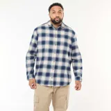 Camisa de manga larga con estampado de cuadros en tonos azul y beige, confeccionada en tejido suave, con cuello clásico y cierre frontal de botones.