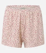 Conjunto de pijama compuesto por un top de breteles finos con encaje en el escote y un short con cintura elástica. El conjunto es de microfibra con estampado de leopardo.