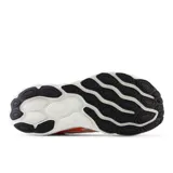 Championes de running New Balance 880 V14, color naranja con detalles en blanco y negro.