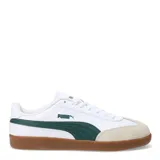 Championes urbanos Puma modelo 9T, color negro con detalles en blanco. Presentan una combinación de cuero sintético y gamuza en la puntera, con la icónica franja lateral de la marca y suela de goma color caramelo.