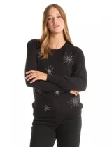 Buzo de punto liviano color negro con apliques de strass en forma de destellos. Presenta cuello redondo, mangas largas con frunce en la copa y terminaciones acanaladas en puños y cintura.