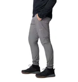 Pantalón técnico Columbia de corte ajustado en color gris, con cintura elástica ajustable mediante cordón y puños elásticos en los tobillos. Presenta paneles reforzados en la parte superior y bolsillos laterales y traseros con cierre.