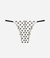 Bombacha de bikini colaless de microfibra color blanco con estampado de lunares negros y tiritas laterales finas en contraste.