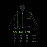 Hoodie con cierre frontal, confeccionado en tejido de punto 100% algodón. Es una prenda reversible con diseño de estampado gráfico en mangas y capucha, y presenta detalles de roturas intencionales en puños, ruedo y bolsillos.