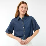 Musculosa de canalé gris melange, con escote redondo y diseño ajustado al cuerpo.