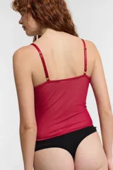 Corset blanco de encaje con copas preformadas, tirantes finos y cierre frontal con cremallera.